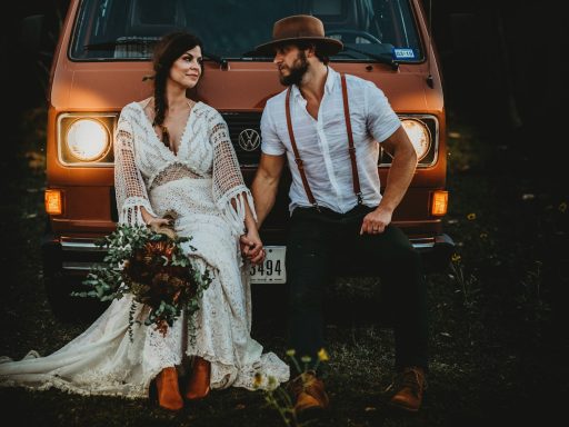 man holding hands of woman while leaning on brown Volkswagen vehicle