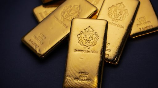 A pile of gold bars sitting on top of a table